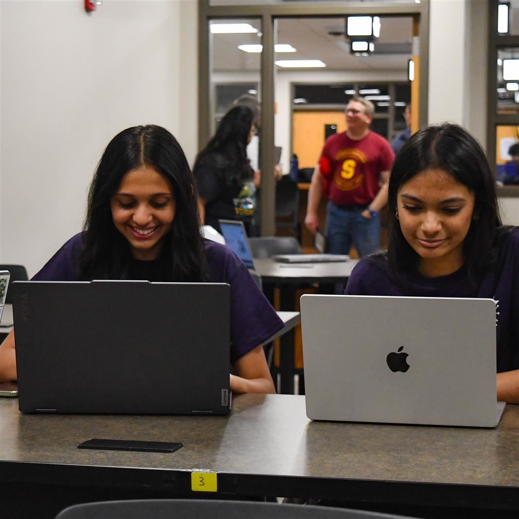  Students from District 211's Hack-a-Thon work on their entry at Fremd High School